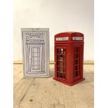 A land line telephone, modeled as a red telephone box, in original box, H40cm W18cm, D19cm
