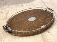 An early 20th century EPNS mounted oak oval twin handled drinks tray, 63cm x 42cm