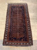 An Afghan Baluchi rug, of all over geometric design, 204cm x 98cm