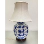 A Chinese blue and white baluster ginger jar style vase lamp decorated with koi carp, with raw