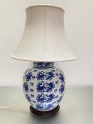 A Chinese blue and white baluster ginger jar style vase lamp decorated with koi carp, with raw