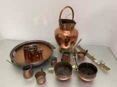 A quantity of copper and brass including a double spouted pitcher with handle, (h 41cm), a set of