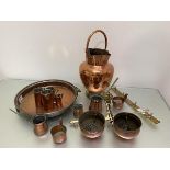 A quantity of copper and brass including a double spouted pitcher with handle, (h 41cm), a set of