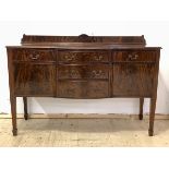 A Georgian style mahogany sideboard, ledge back over five drawers and two cupboards, raised on