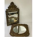 A Dutch arch hammered brass miniature wall mirror with bevelled glass, the surmount
