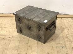 An Arts and Crafts style polished and hammered steel coal box, with carry handle to each end and