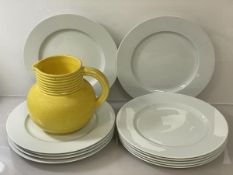 A set of eleven Limoges dinner plates (d 26.5cm), and a yellow water jug
