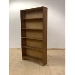 A 20th century oak open floor standing bookcase, with four fixed shelves, H141cm, W74cm, D22cm