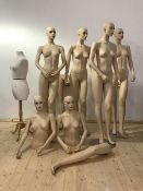 A set of six painted injection moulded polyurethane female shop display mannequins, on circular