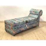 A mid century chaise ottoman, upholstered in geometric fabric, the hinged opening to reveal fitted