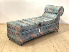 A mid century chaise ottoman, upholstered in geometric fabric, the hinged opening to reveal fitted