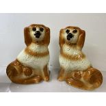 A pair of Staffordshire pottery chimney spaniels, (h 28cm)