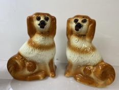 A pair of Staffordshire pottery chimney spaniels, (h 28cm)