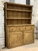 A 19th century pine dresser, with two height plate rack over two drawers and two cupboards,