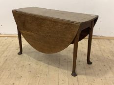 An 18th century oak drop leaf table, the oval top over turned swing legs with pad feet H70cm,