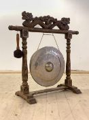 A Chinese hardwood floor standing diner gong, with dragon surmount, brass gong and beater, H96cm,