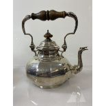 A Carringtons & Co silver kettle, London 1911, initials to one side, (h 24cm) weighs approximately