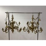A pair of gilt brass Dutch style chandliers with ceiling rose, chain and six scrolled branches,