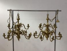 A pair of gilt brass Dutch style chandliers with ceiling rose, chain and six scrolled branches,