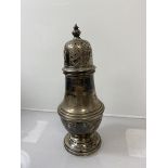 A silver sugar caster, Birmingham 1983, (h 14.5cm) weighs 102 grammes