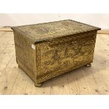 An early 20th century hammered brass coal box, the top and front depicting sea faring scenes, with