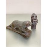 An Inuit carving of an otter of variegated green and brown soapstone, engraved verso WPO, and an