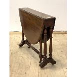 A Victorian mahogany drop leaf stretcher table, with circular moulded top on turned swing leg and