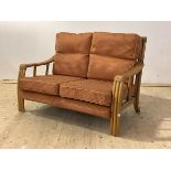 A late 20th century bamboo two seat veranda sofa with upholstered squab cushions, H89cm, W130cm,