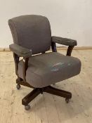 A Mid 20th century upholstered swivel and reclining desk chair on castors, H89cm, W68cm, D60cm