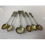 A collect of white metal spoons including Indian spoon with a two Annas coin, dated 1916, (13cm),