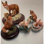 A collection of composition made animal figures including Border Fine Arts Feed Time 1996, James