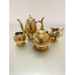 A Victorian brass engraved four piece tea and coffee service in grey floral sprays and swan finial's