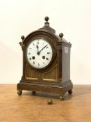An early 20th century oak cased bracket clock, the domed case with brass ball finals and panelled