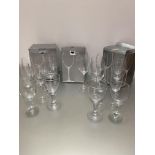 Seventeen large John Lewis crystal Vino wine glasses, five champagne glasses and a collection of