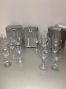 Seventeen large John Lewis crystal Vino wine glasses, five champagne glasses and a collection of