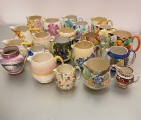 A collection of twenty two various jugs including Grimswades, Grays Pottery, a Sunderland lustre