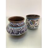 Two Middle Eastern copper enamelled pots, one with Farsi script the other with stylised lotus flower