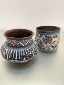 Two Middle Eastern copper enamelled pots, one with Farsi script the other with stylised lotus flower