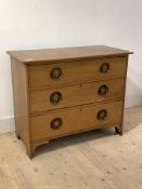 An ash chest, circa 1940's, fitted with three drawers, raised on shaped panel end supports, H76cm,
