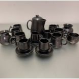 An English Prinknash Abbey pewter ware part coffee and tea set including mugs, a coffee pot, milk