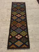 A Maimana kilim runner with repeating lozenge motif 211cm x 68cm