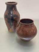 A brown terracotta pottery baluster ribbed vase with oxidised glaze, unmarked, (h 35cm x d 18cm) and