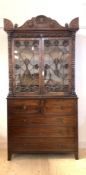 A mahogany secretaire bookcase, early 19th century, the top in the manner of William Trotter,