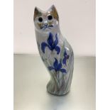 A stoneware pottery cat decorated with iris design, (h46cm x 15cm x 12cm)