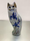 A stoneware pottery cat decorated with iris design, (h46cm x 15cm x 12cm)