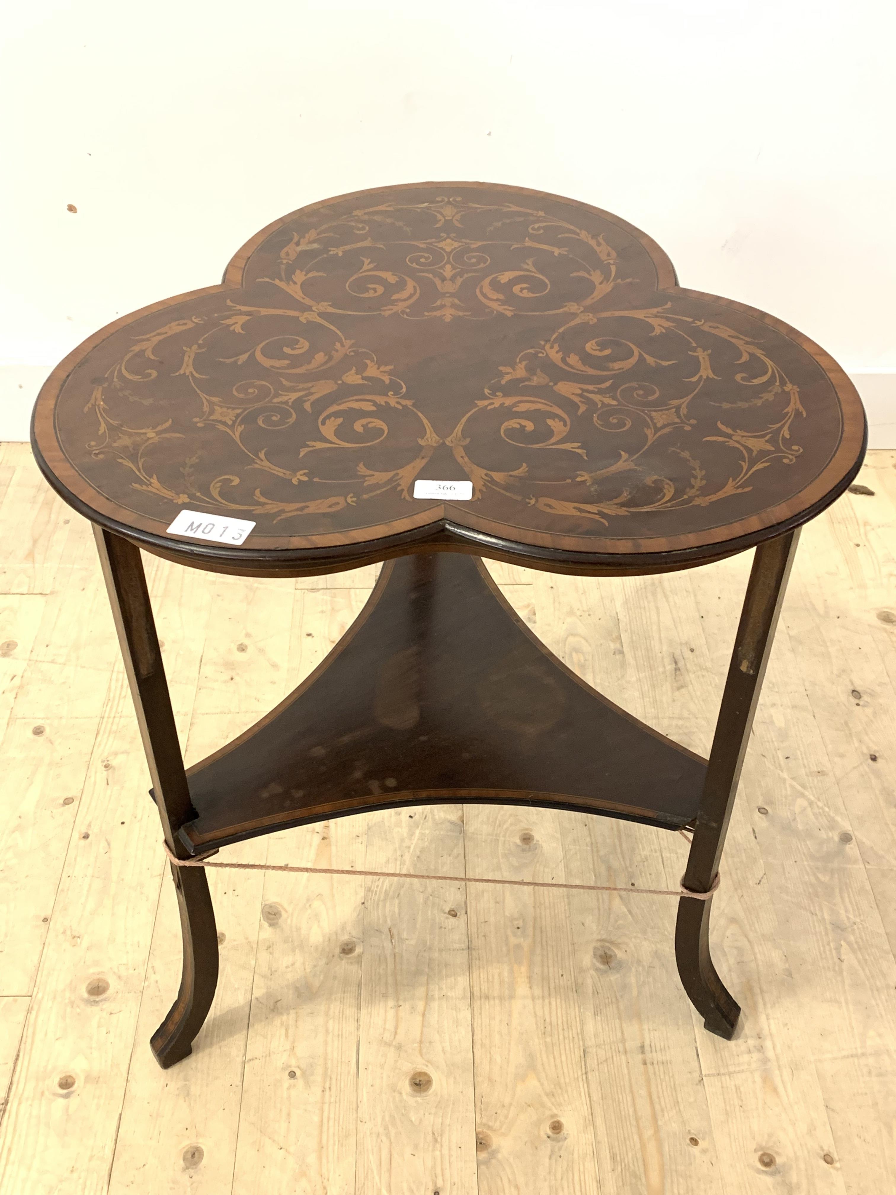 An Edwardian mahogany occasional table, the top, of lobed form, well inlaid in boxwood with