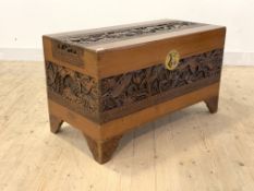 A Mid 20th century Chinese carved camphour wood blanket box with hinged lid and bracket supports,