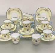 A Paragon china 1920's / 30's, 32-piece tea service with handpainted enamel floral sprays, with blue