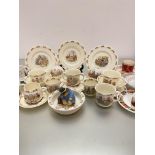 A collection of children's Bunnykins Royal Doulton pottery including four plates, four feeding