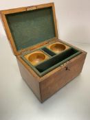 An oak rent box, the hinged top enclosing a fitted interior with lift out section with two coin